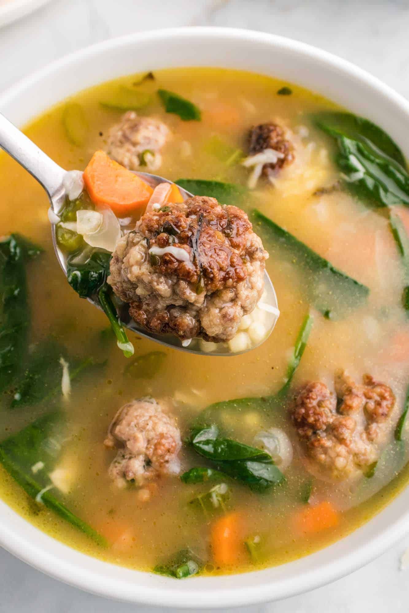 Eating italian wedding soup with a spoon