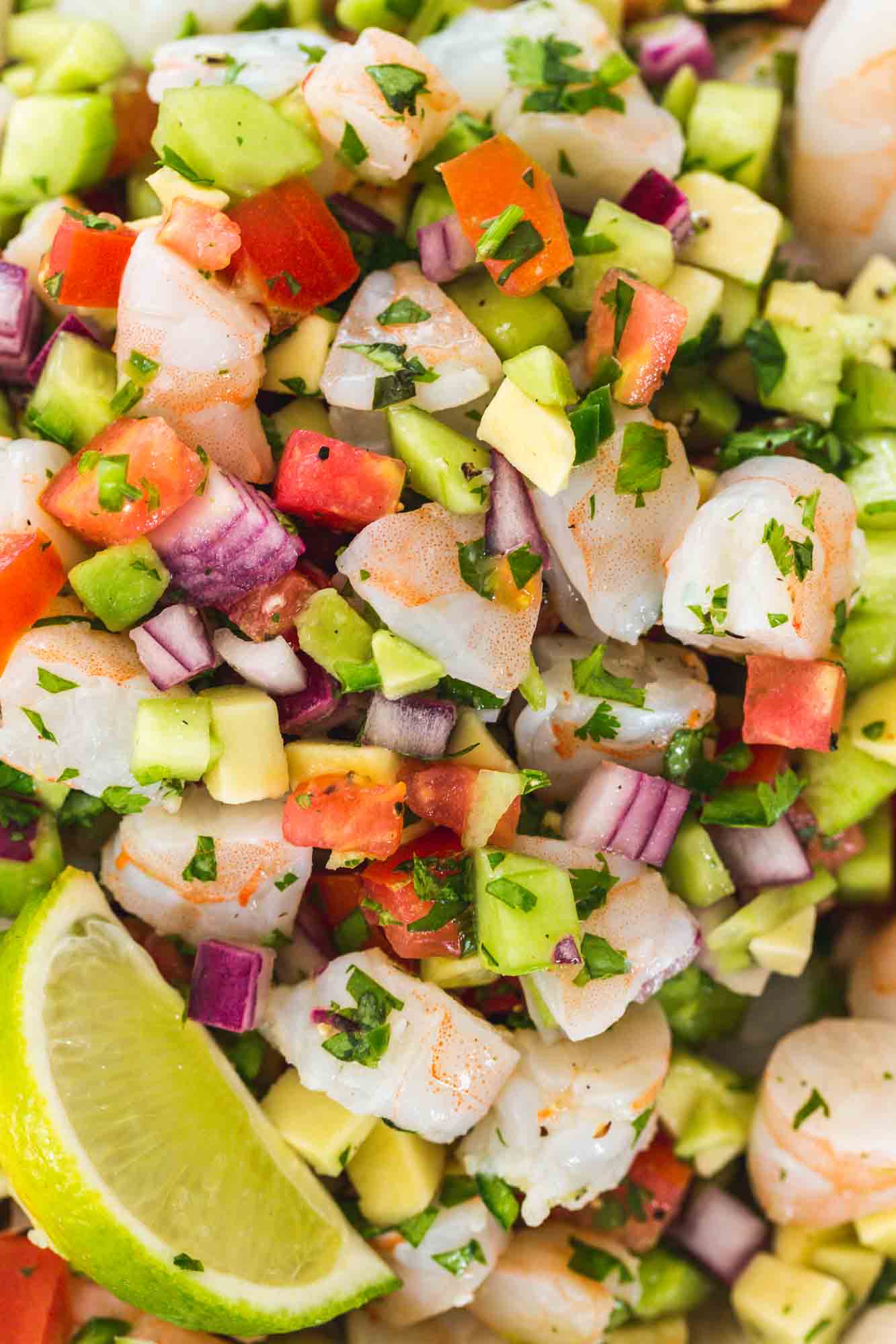 Close up shot of Shrimp ceviche with fresh lime wedges