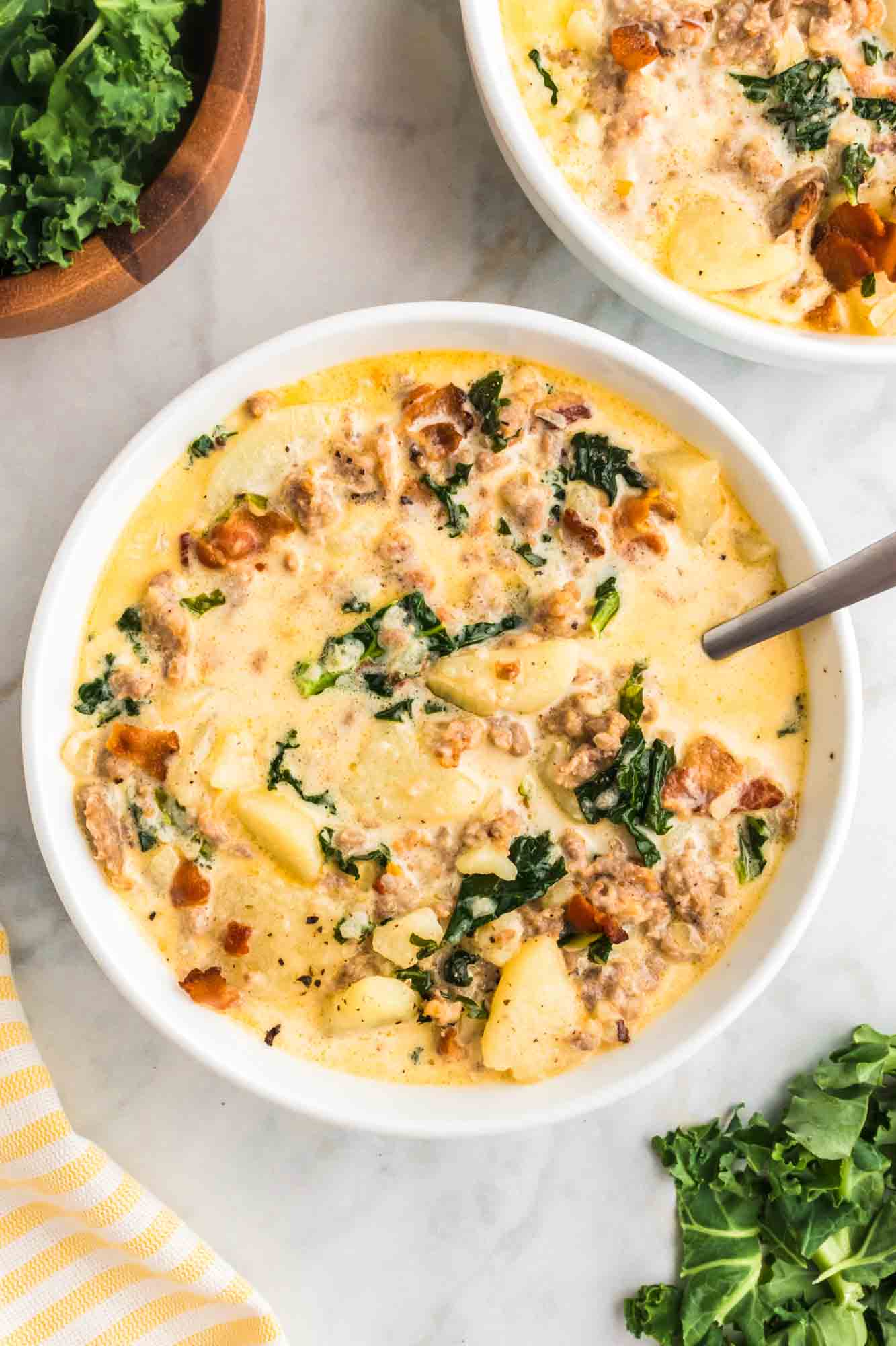 Overhead shot of 2 bowls of zuppa toscana soup