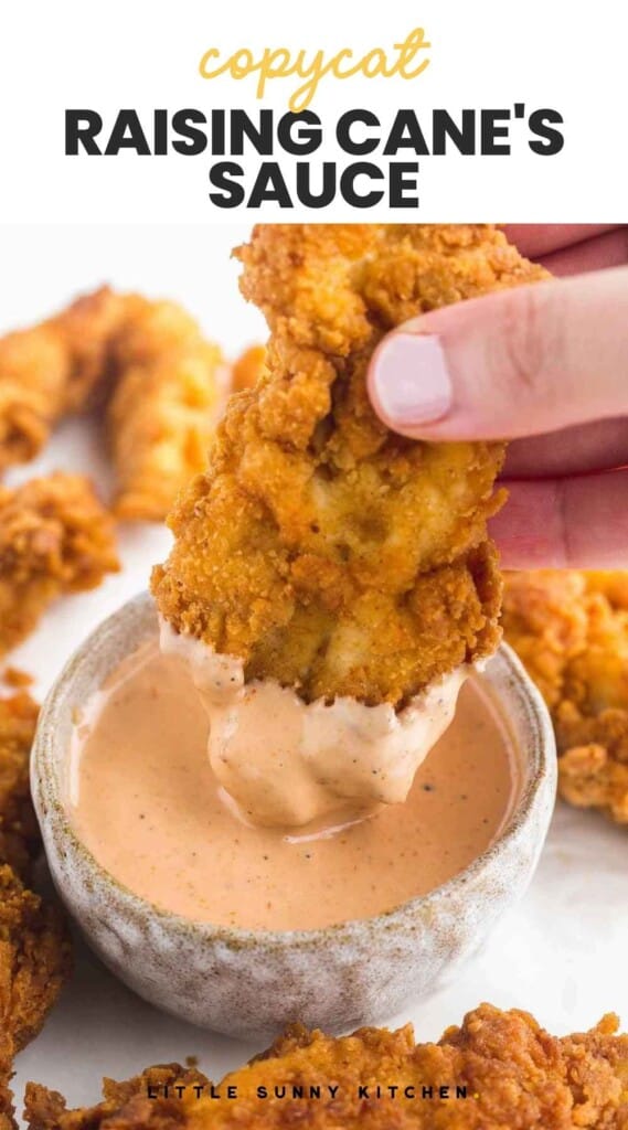 Dipping chicken finger in Cane's sauce, and overlay text "copycat raising cane's sauce"