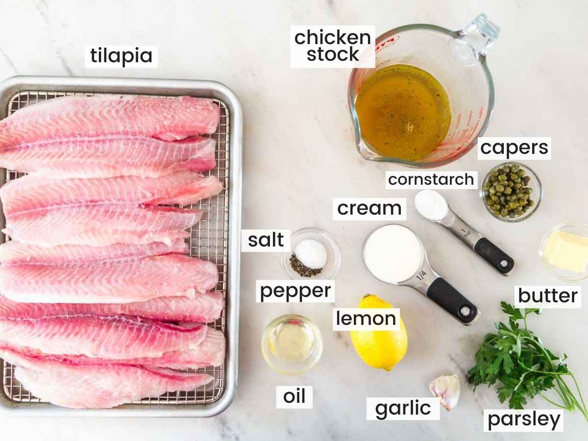Ingredients needed to make grilled tilapia with a piccata sauce including tilapia fillets, stock, lemon, heavy cream, and seasonings.