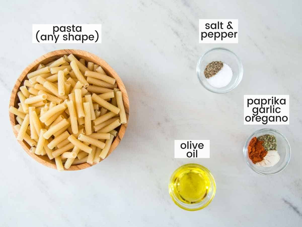 Ingredients needed to make pasta chips including pasta, oil, and seasonings.