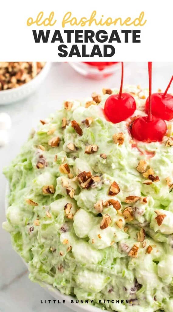 Close up side shot of watergate salad topped with crushed pecans and maraschino cherries, and overlay text "old fashion watergate salad"
