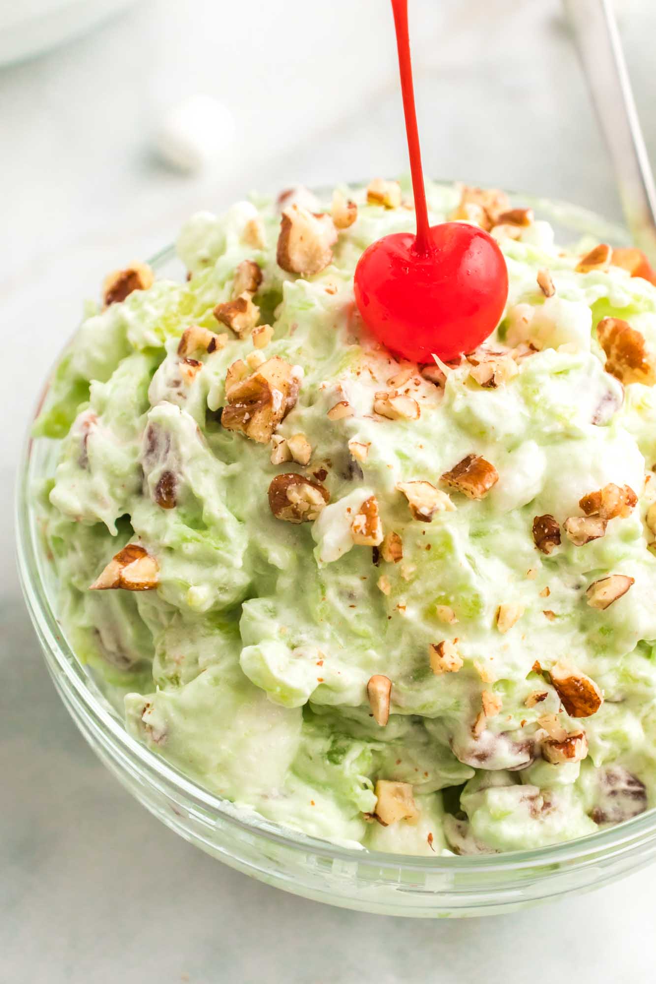 Single serving of watergate salad served in a small glass bowl