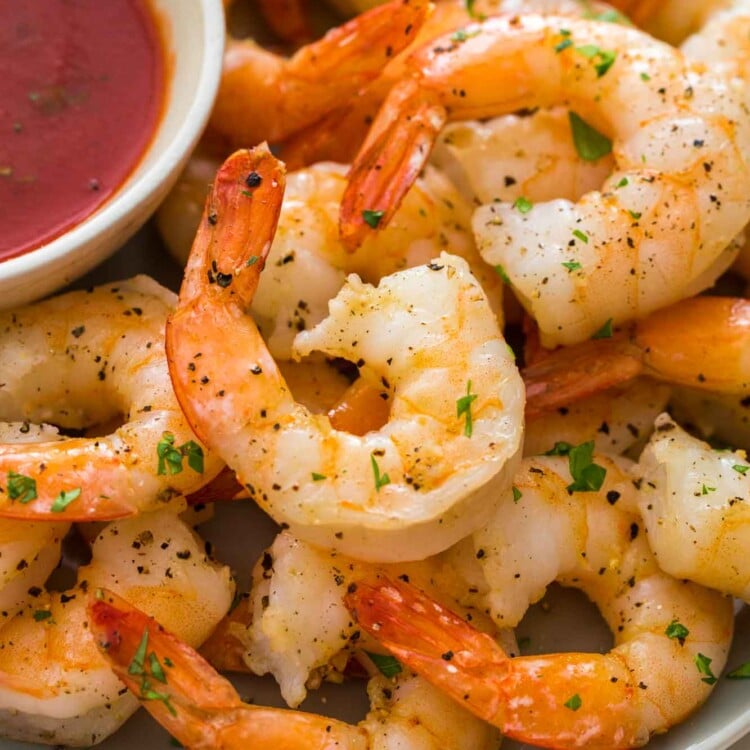 Perfectly cooked shrimp served with marinara sauce on the side