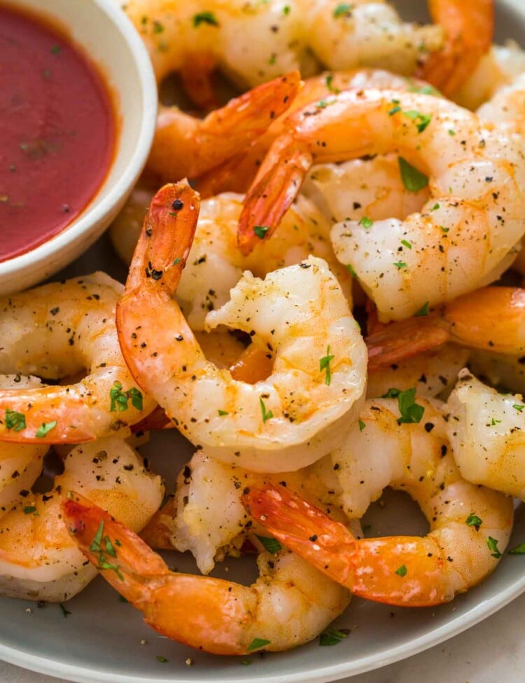 Perfectly cooked shrimp served with marinara sauce on the side