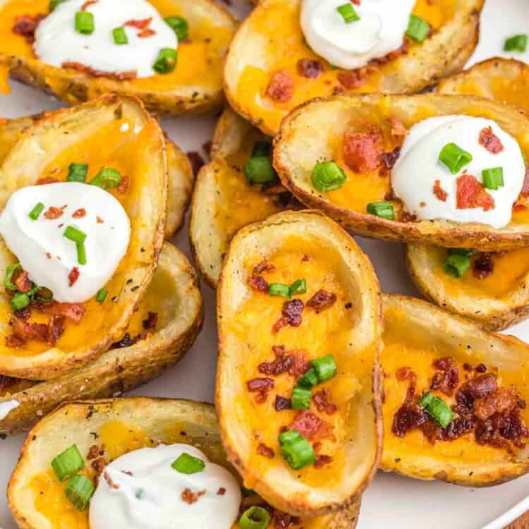 Baked potato skins served on a large white plate