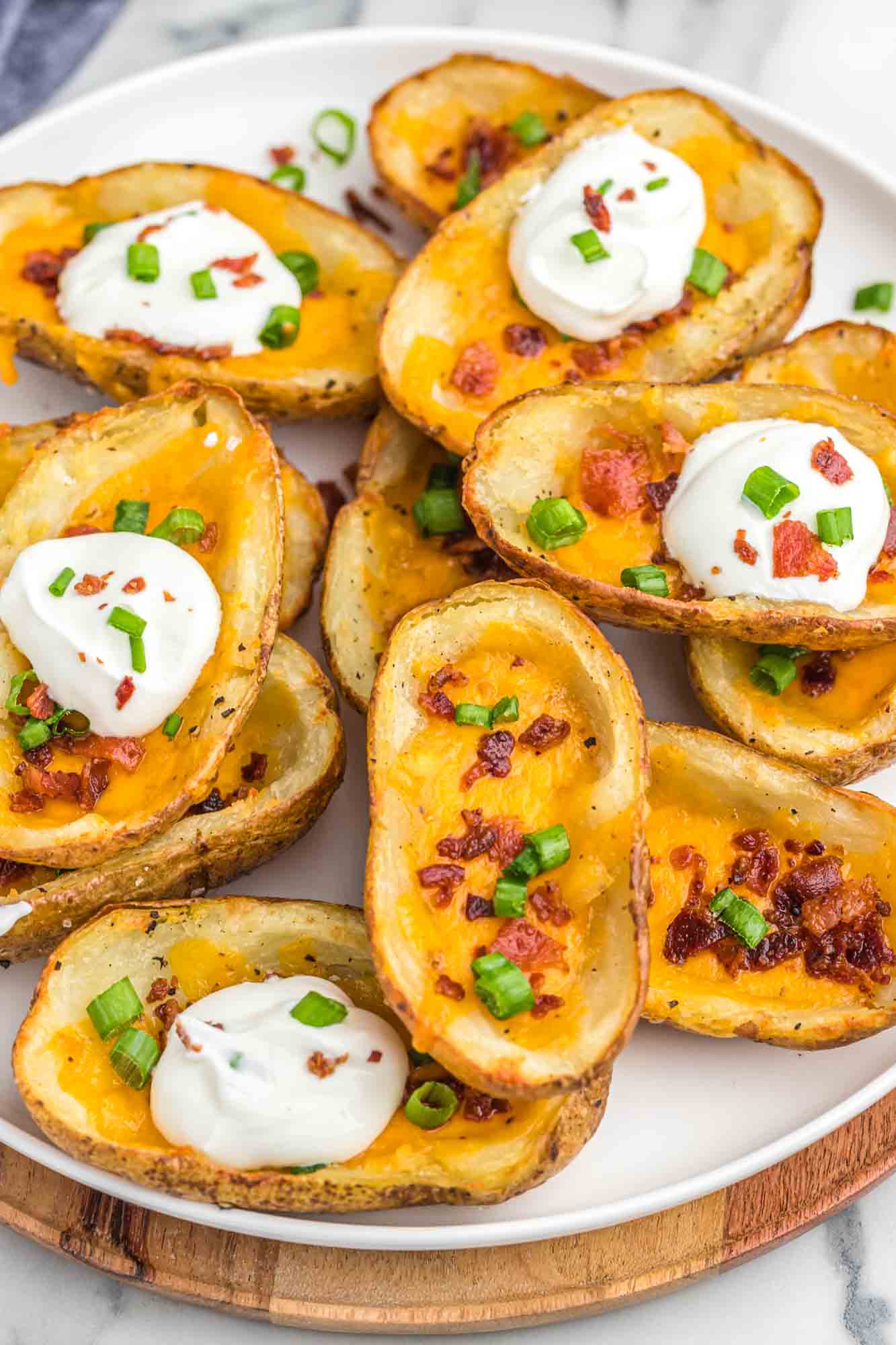 Baked potato skins served on a large white plate