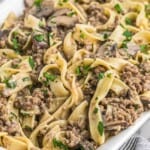 Ground beef stroganoff with egg noodles served in a white casserole dish