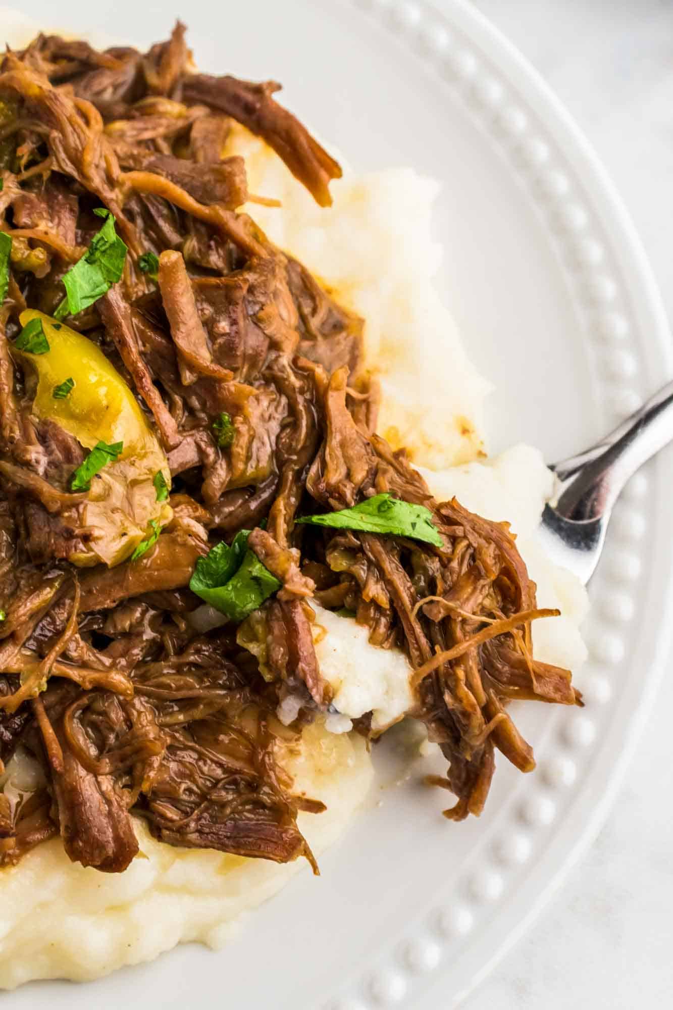 Mississippi roast served over creamy mashed potatoes