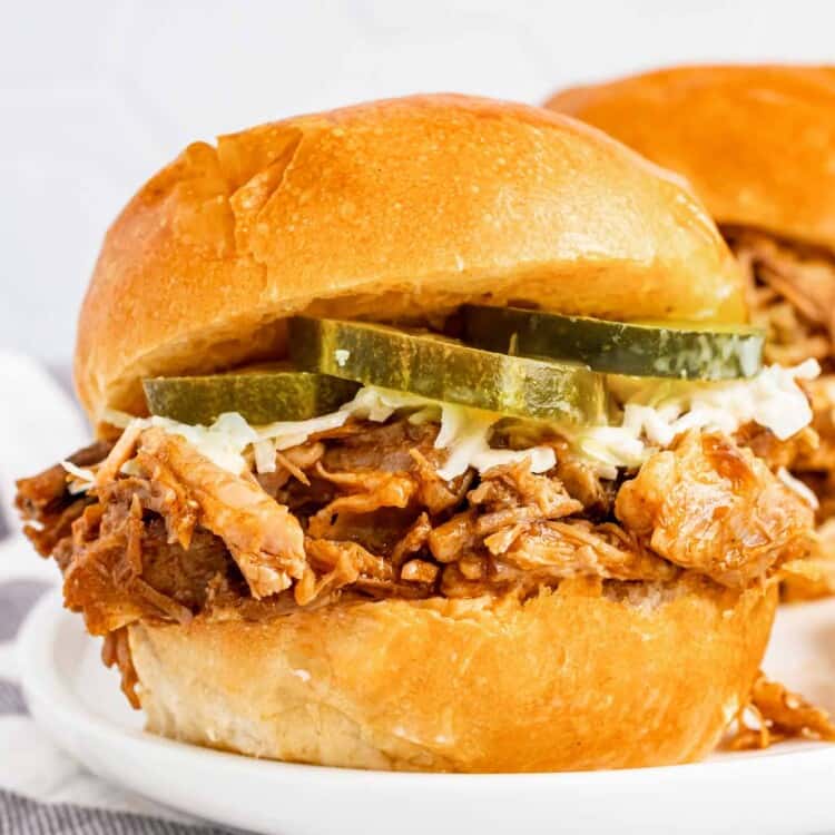 Pulled pork in a slider with slaw and pickles