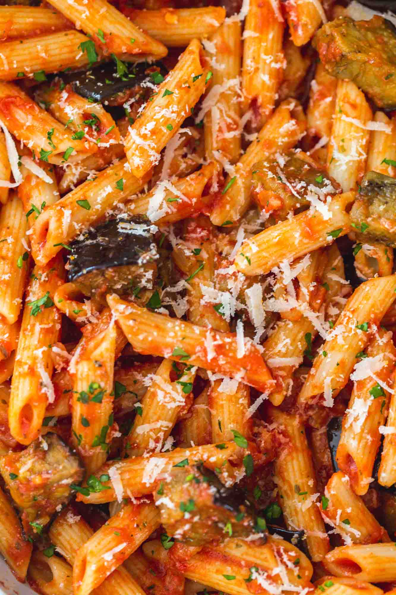 Close up shot of eggplant pasta with parmesan on top