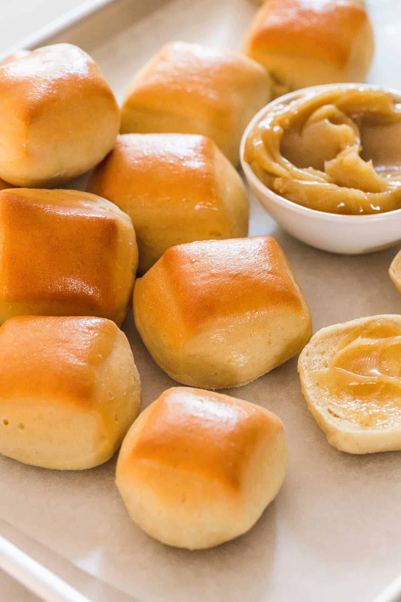 A few Texas roadhouse rolls served with cinnamon honey butter on the side