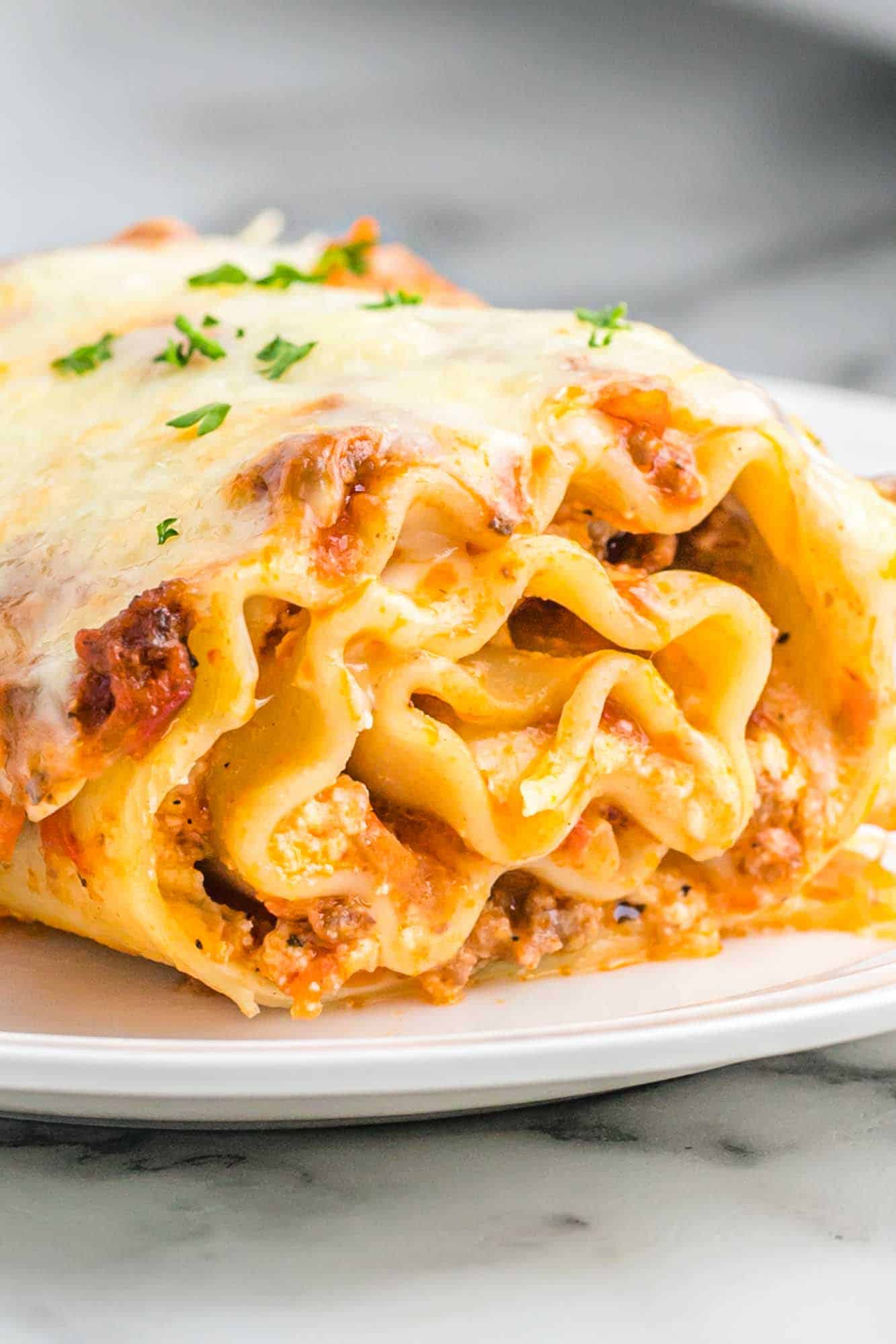 Close up shot of a cheesy lasagna roll up