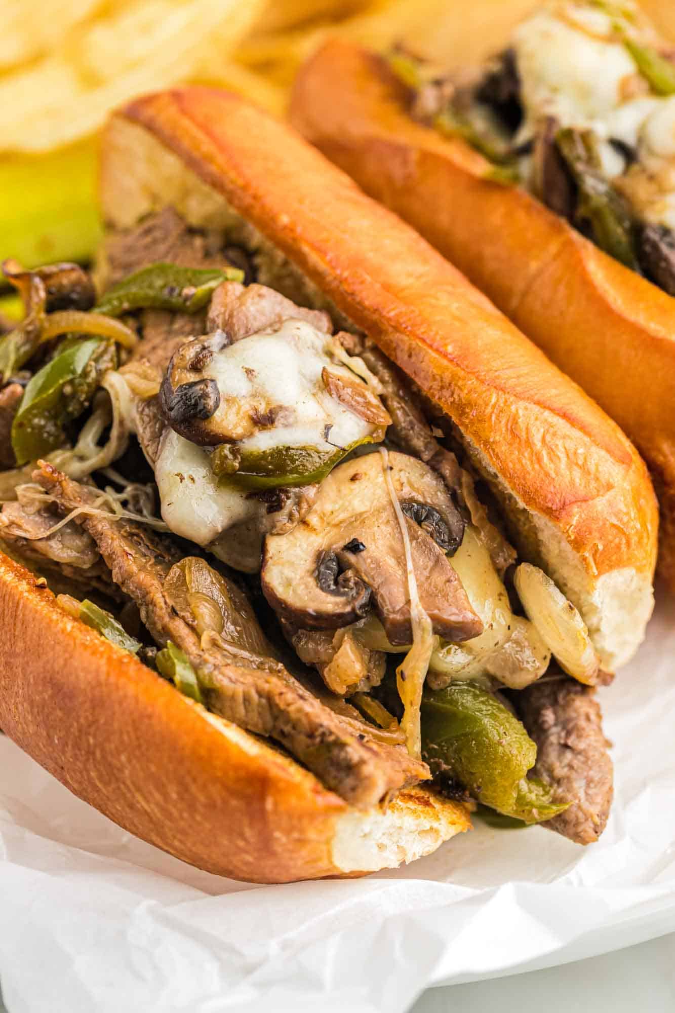 Philly cheesesteak sandwiches served on a plate