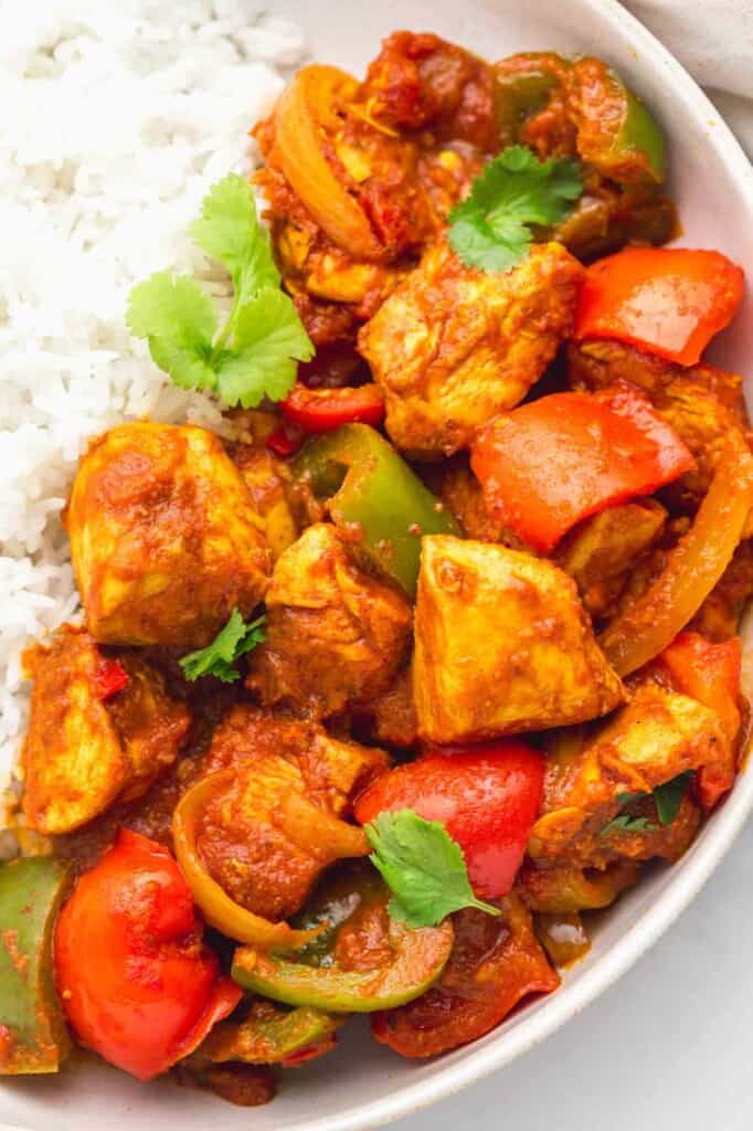 Close up shot of chicken jalfrezi served over rice