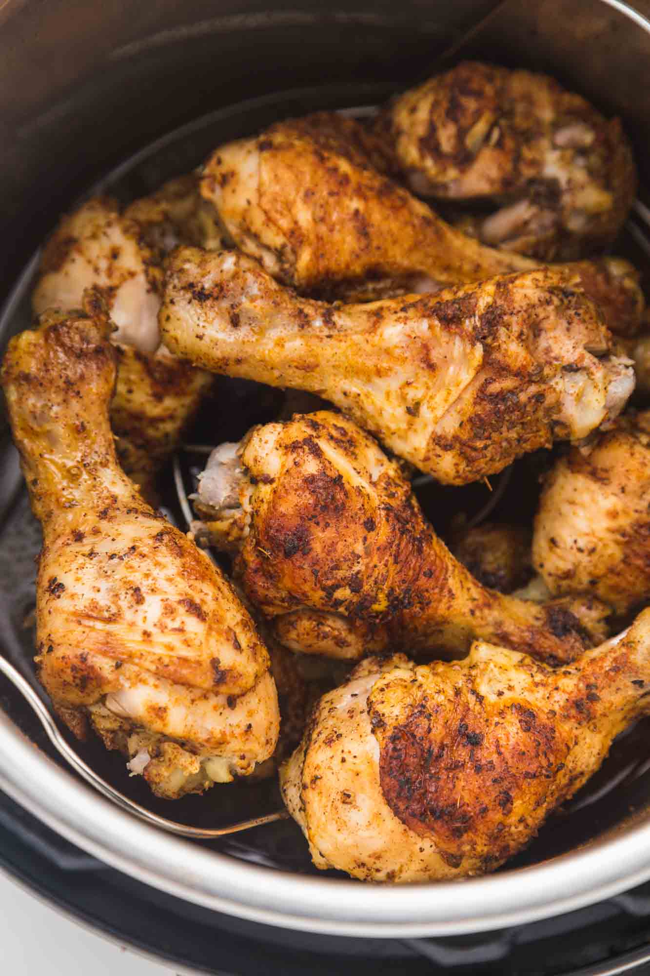 Seasoned and cooked drumsticks in the Instant Pot