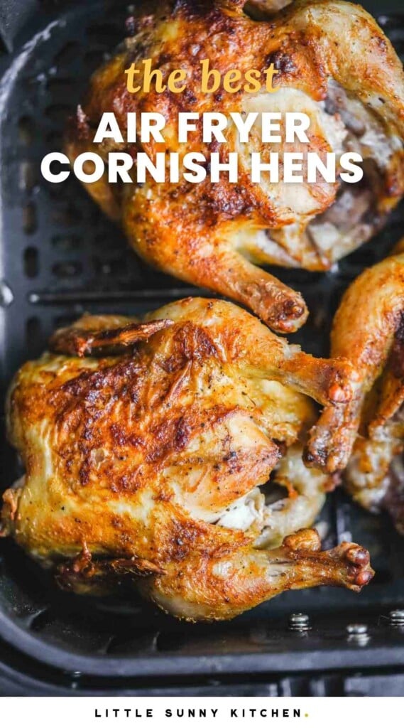 Overhead shot of roasted cornish hens in the air fryer basket, and overlay text that says "the best Air Fryer Cornish Hens"