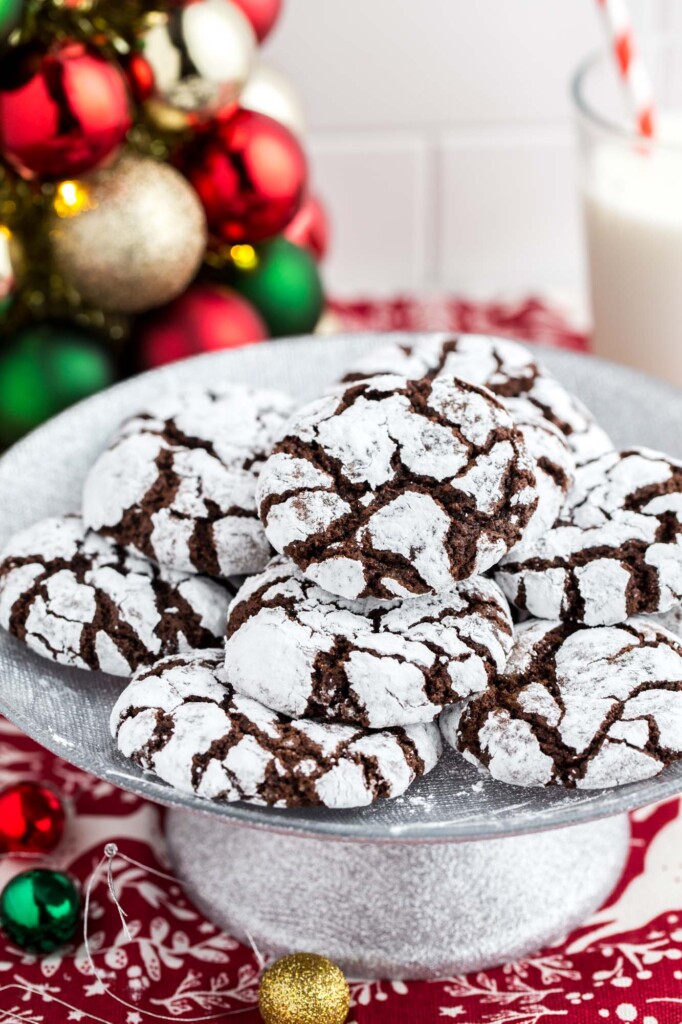 Chocolate crinkle cookies served on a small silver cake stand
