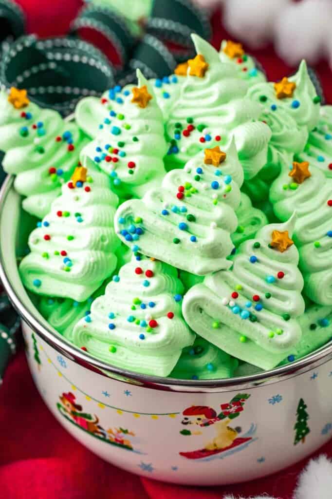 Mini meringue christmas tree cookies in a bowl