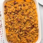 Overhead shot of sweet potato casserole with crunchy pecans and streusel topping