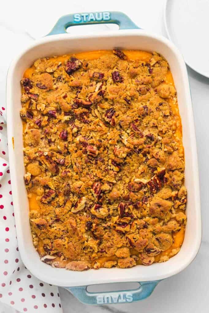 Overhead shot of sweet potato casserole with crunchy pecans and streusel topping