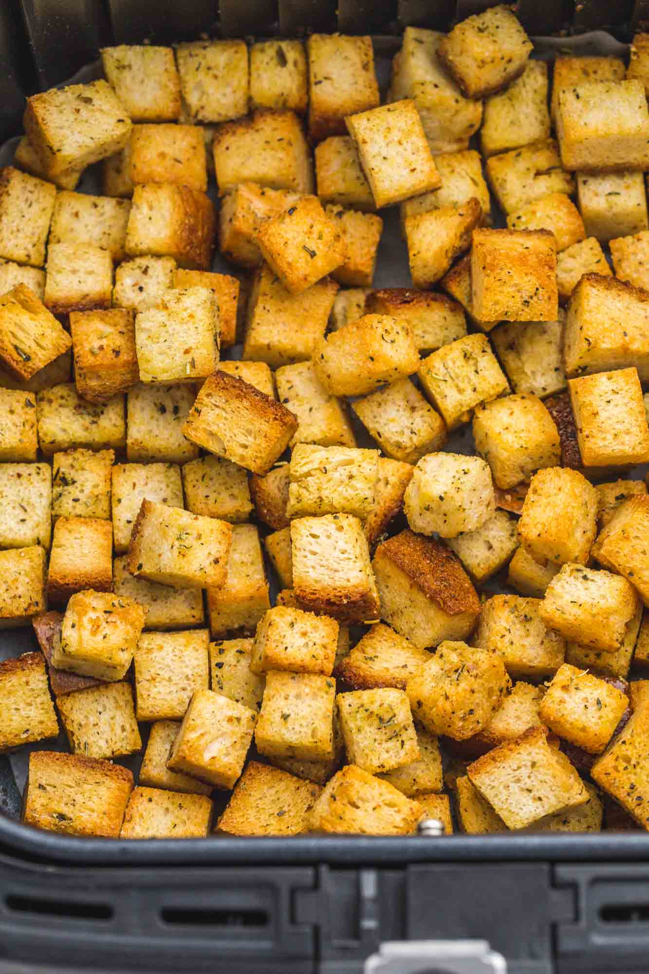 Golden brown croutons in the Air Fryer basket