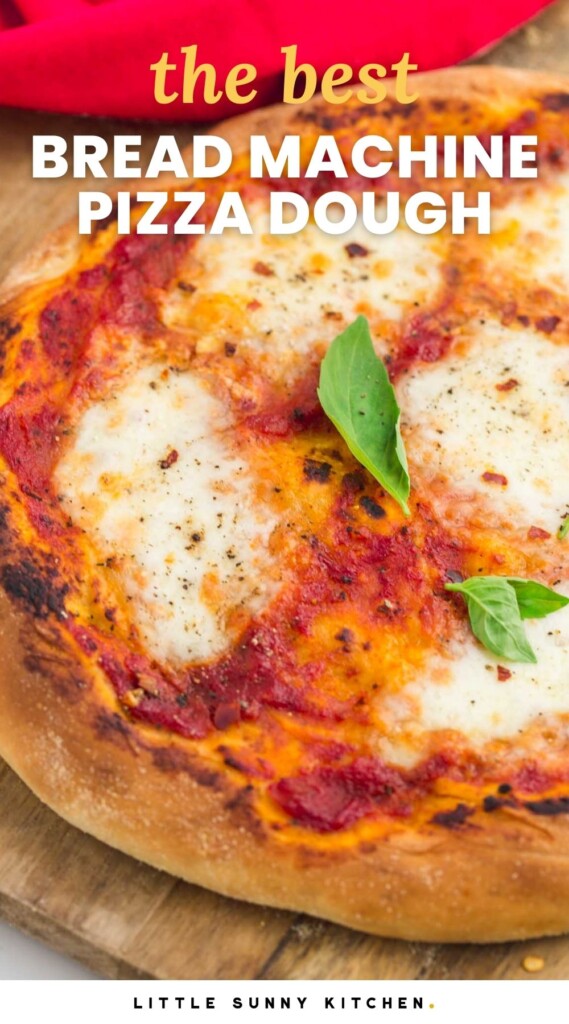 Perfect simple baked pizza, with mozzarella and fresh basil leaves. With overlay text that says "the best bread machine pizza dough"