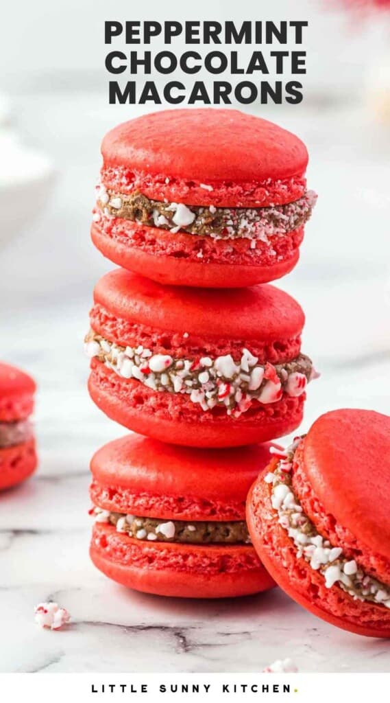 Three peppermint red macarons with chocolate filling stacked, and overlay text that says "Peppermint Chocolate Macarons"