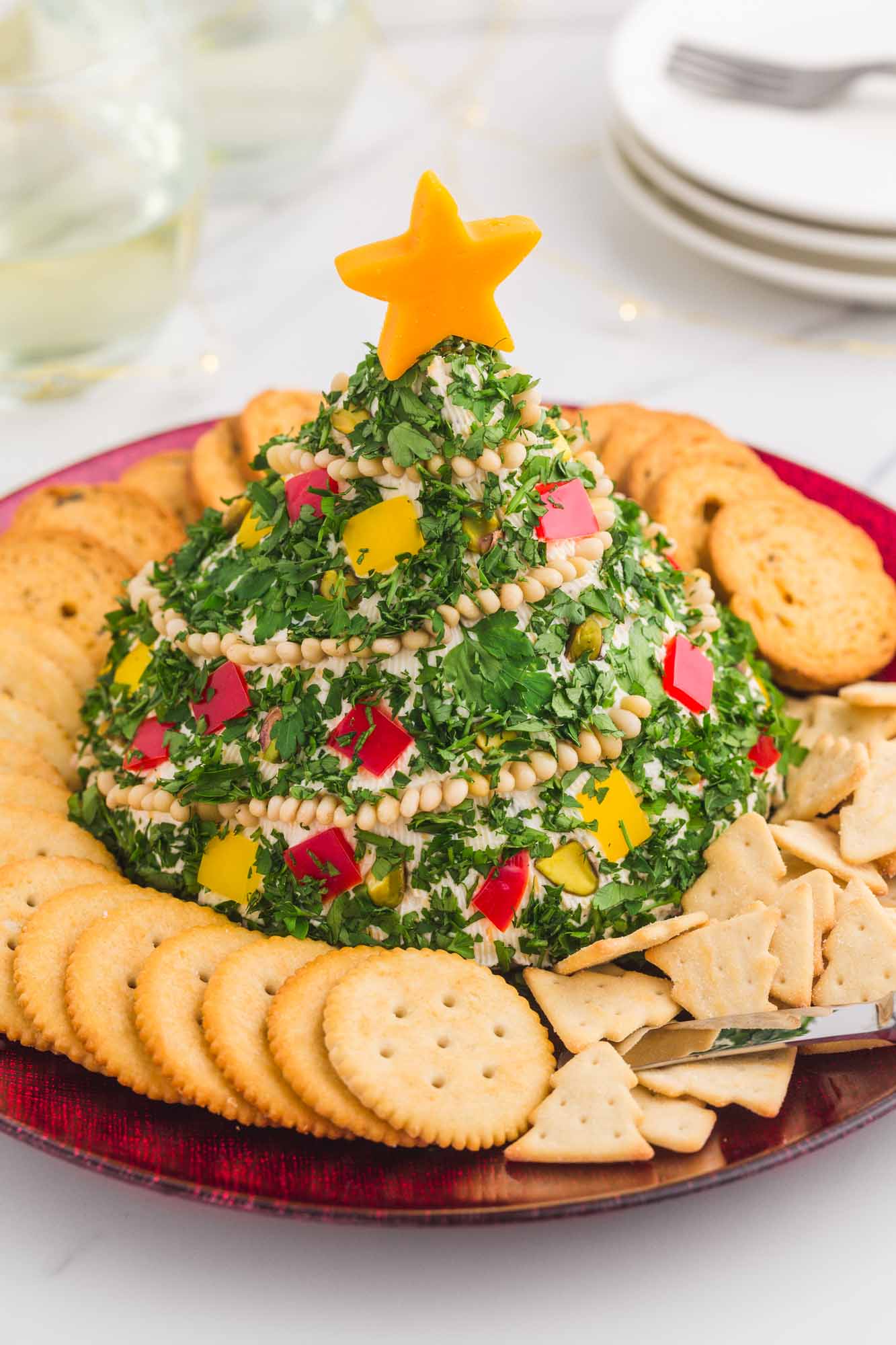 Christmas tree shaped cheese ball served with crackers