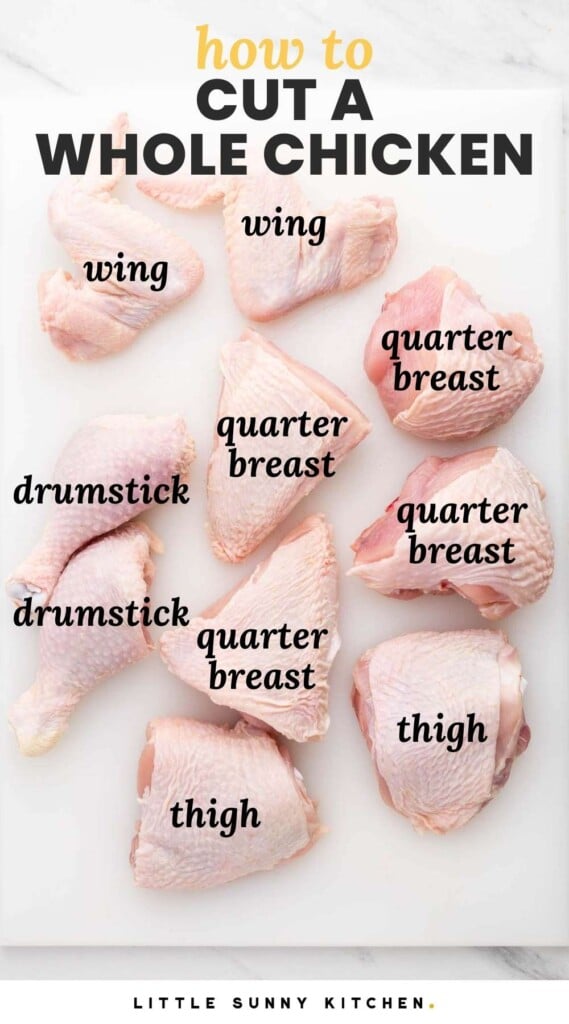 A whole chicken cut up in 10 pieces, placed on a white cutting board