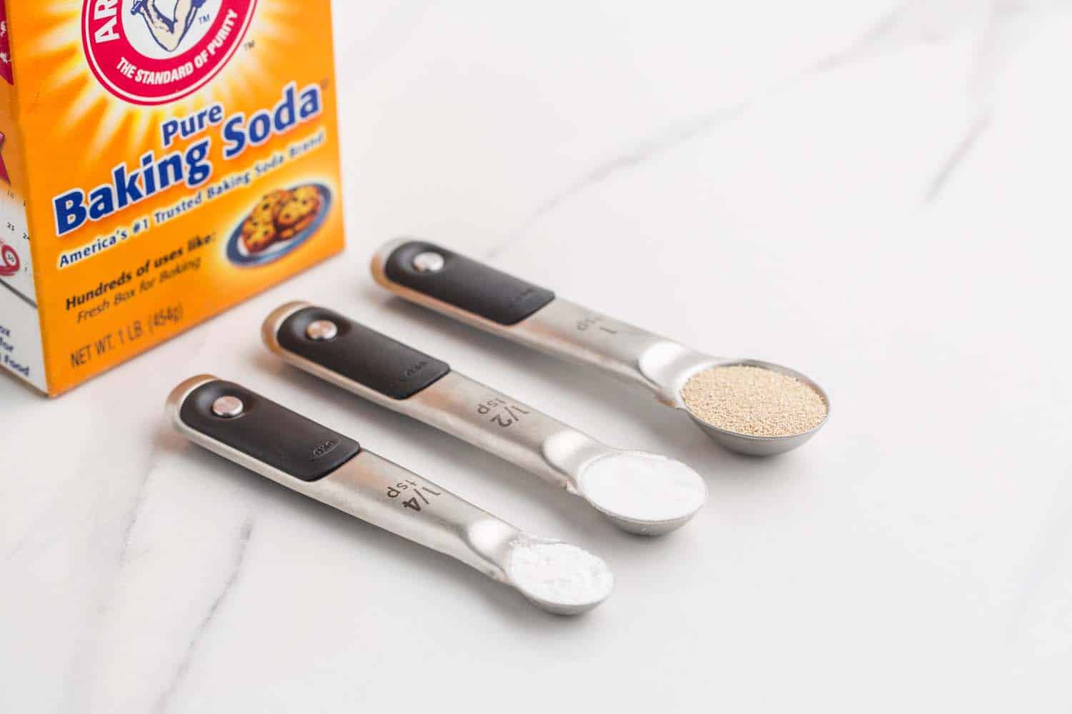 baking powder and soda and yeast in measuring spoons