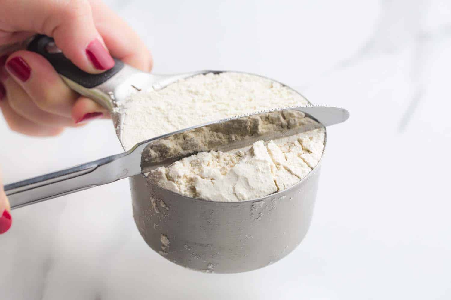 Measuring flour in a measuring cup