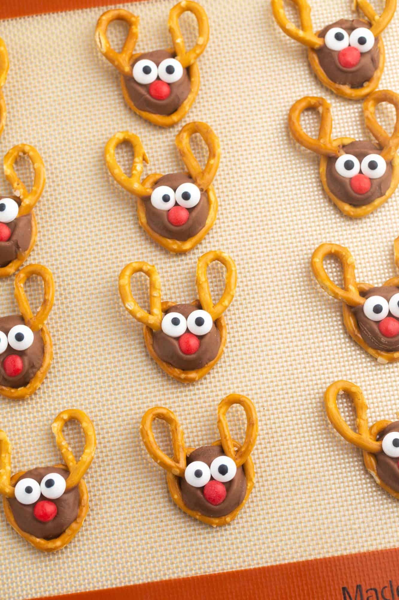 Overhead shot of reindeer treats on a silicone baking mat