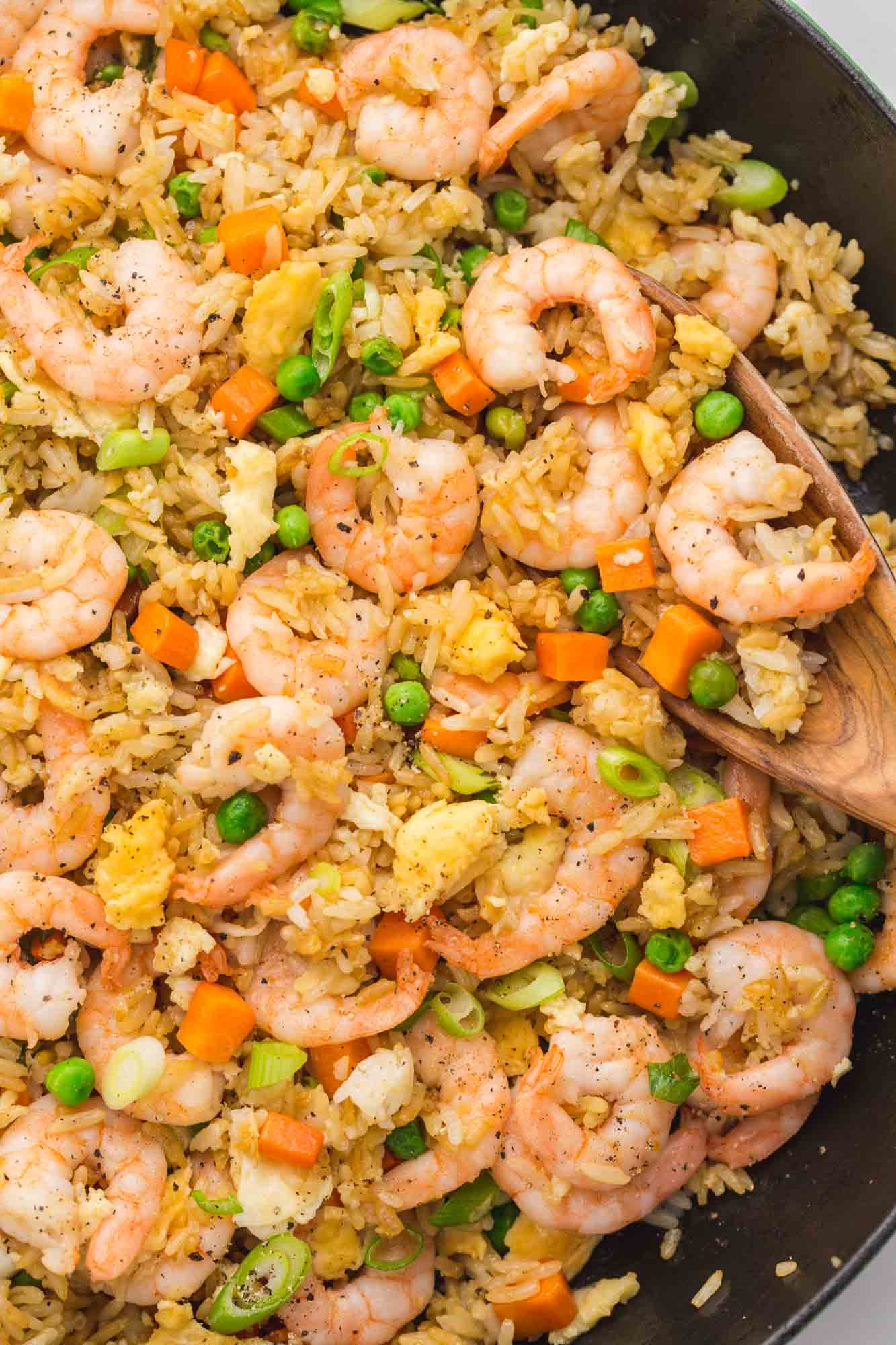 Overhead shot of shrimp fried rice in a cast iron Staub skillet