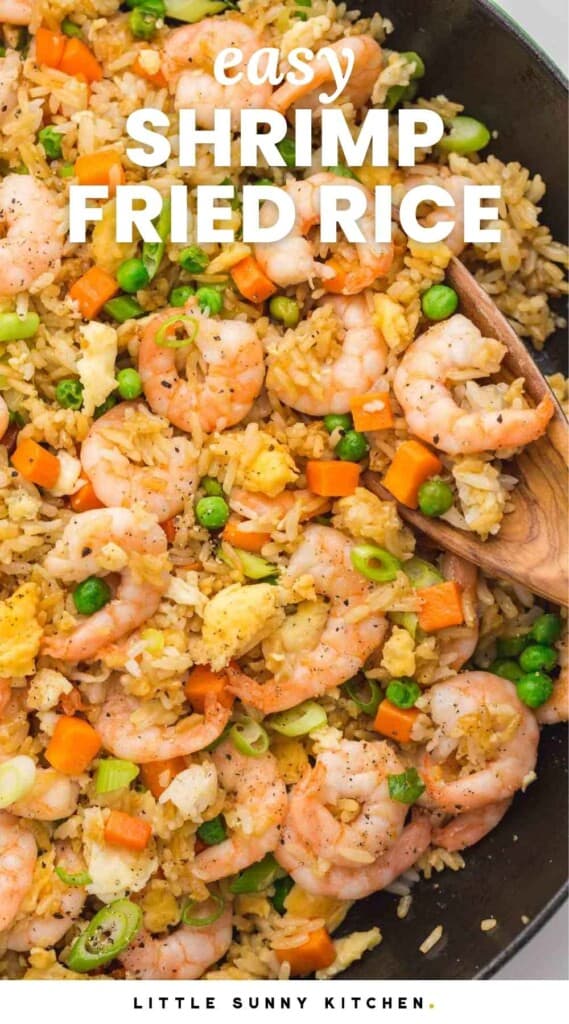 Overhead shot of shrimp fried rice in a cast iron Staub skillet, with overlay text that says "easy shrimp fried rice"