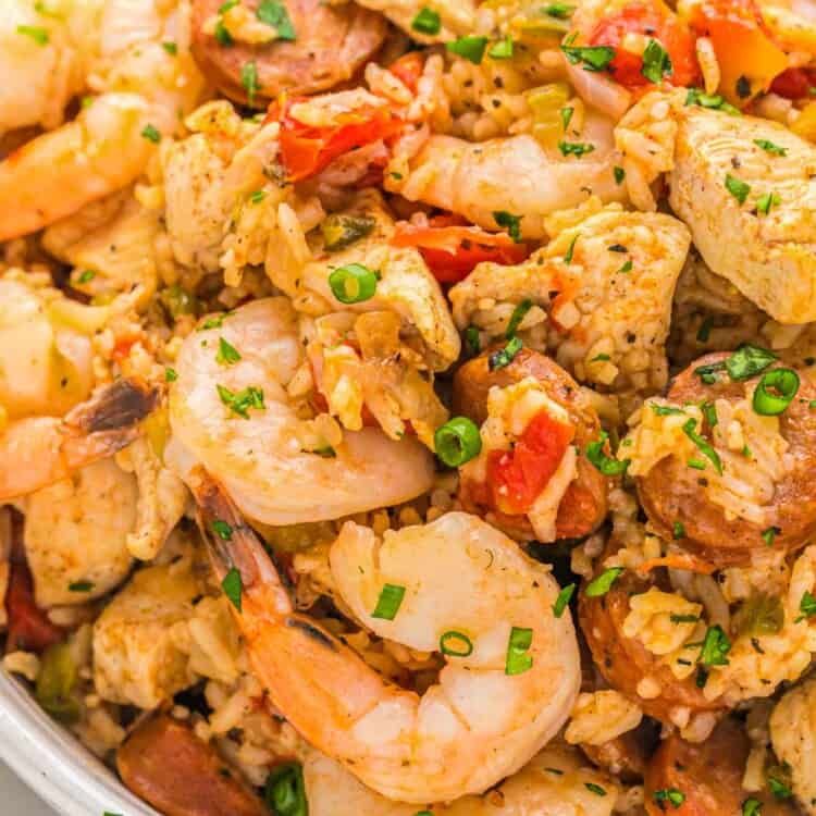 Close up shot of jambalaya with chicken, shrimp and sausage served in a large serving bowl.