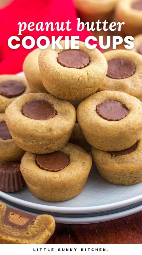 Stacked peanut butter cup cookies on 2 small plates, with a red tea towel in the background. With overlay text that says "peanut butter cookie cups"