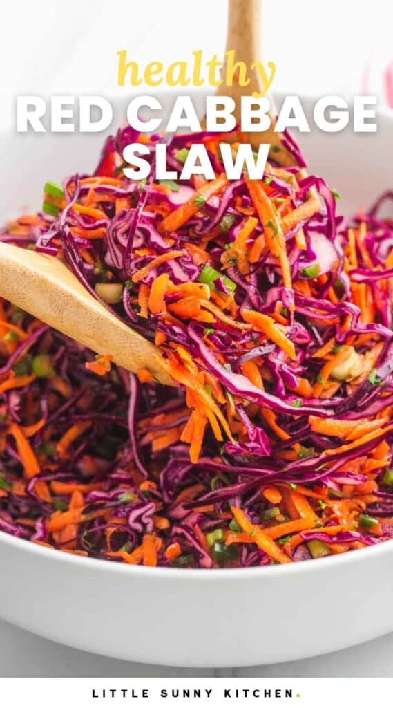 Tossing and serving red cabbage slaw using 2 wooden spoons. With overlay text that says "healthy red cabbage slaw"