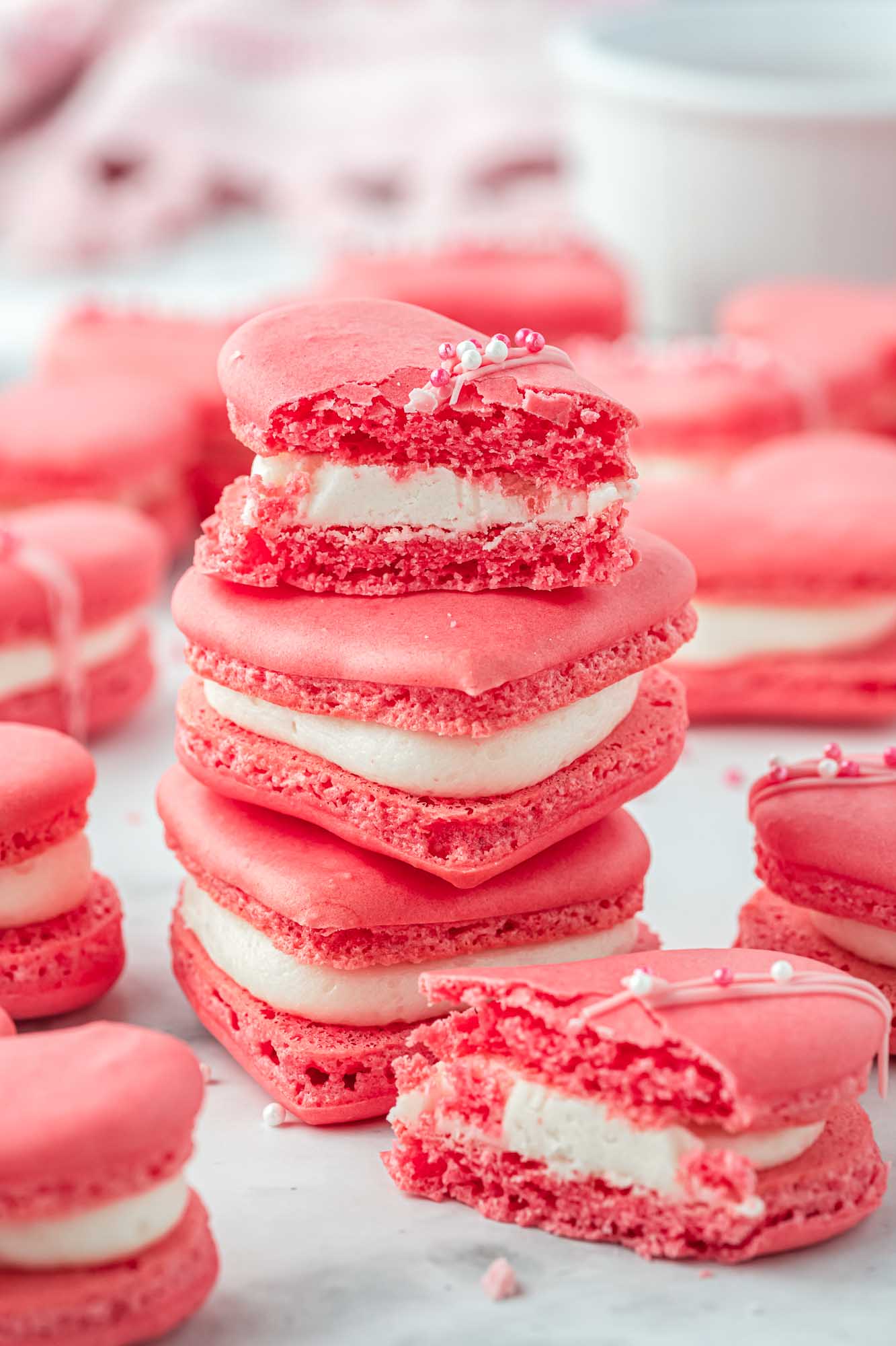 Stacked heart macarons, with a bite shot.