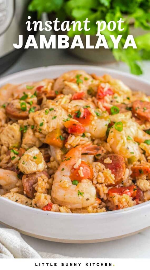 Instant Pot jambalaya in a large white bowl, served. And overlay text that says "instant pot jambalaya"
