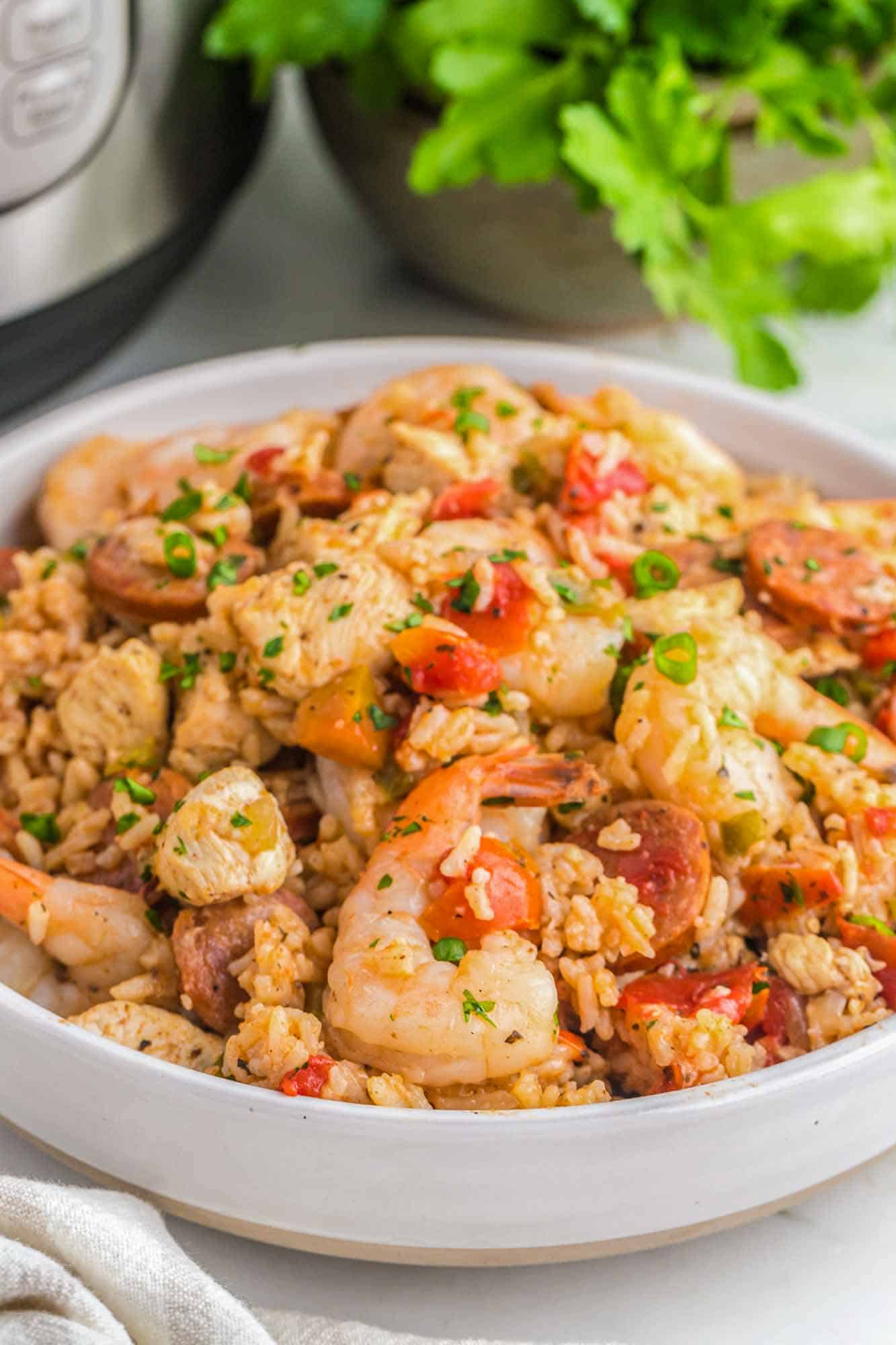 Instant Pot jambalaya in a large white bowl, served.