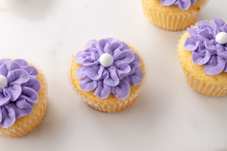 Purple flower cupcakes with white candy center