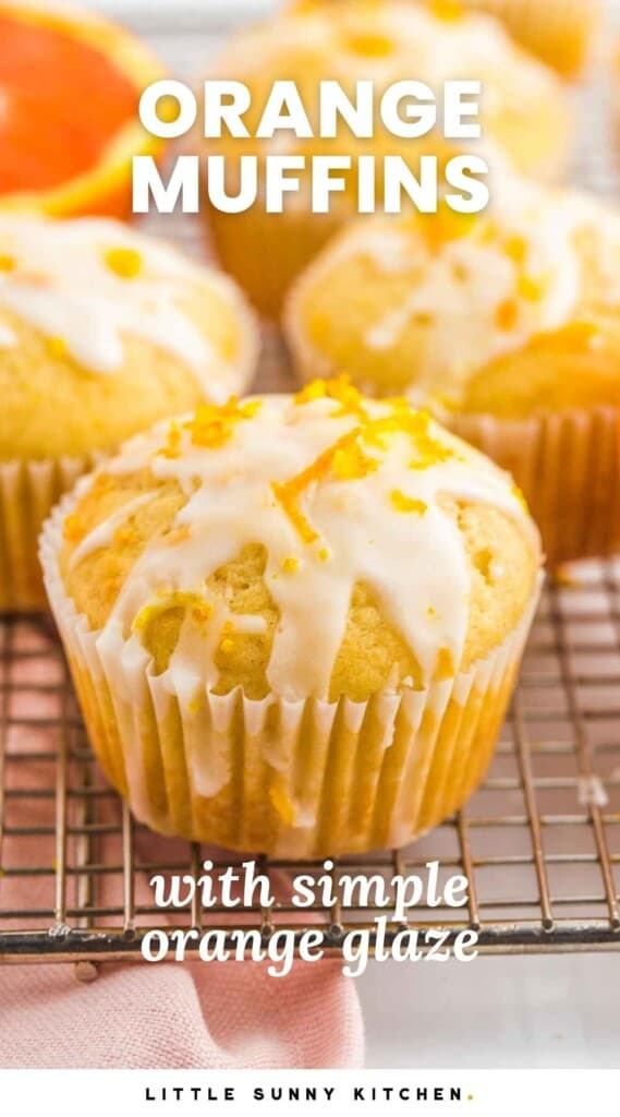 Iced orange muffins on a wire rack. And overlay text that says "Orange muffins with simple orange glaze"