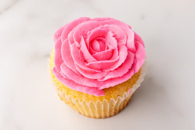 Full buttercream pink rose on a cupcake