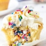 Pinata cupcake with spilled out sprinkles