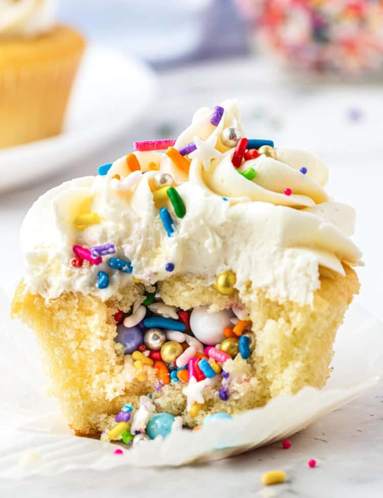Pinata cupcake with spilled out sprinkles