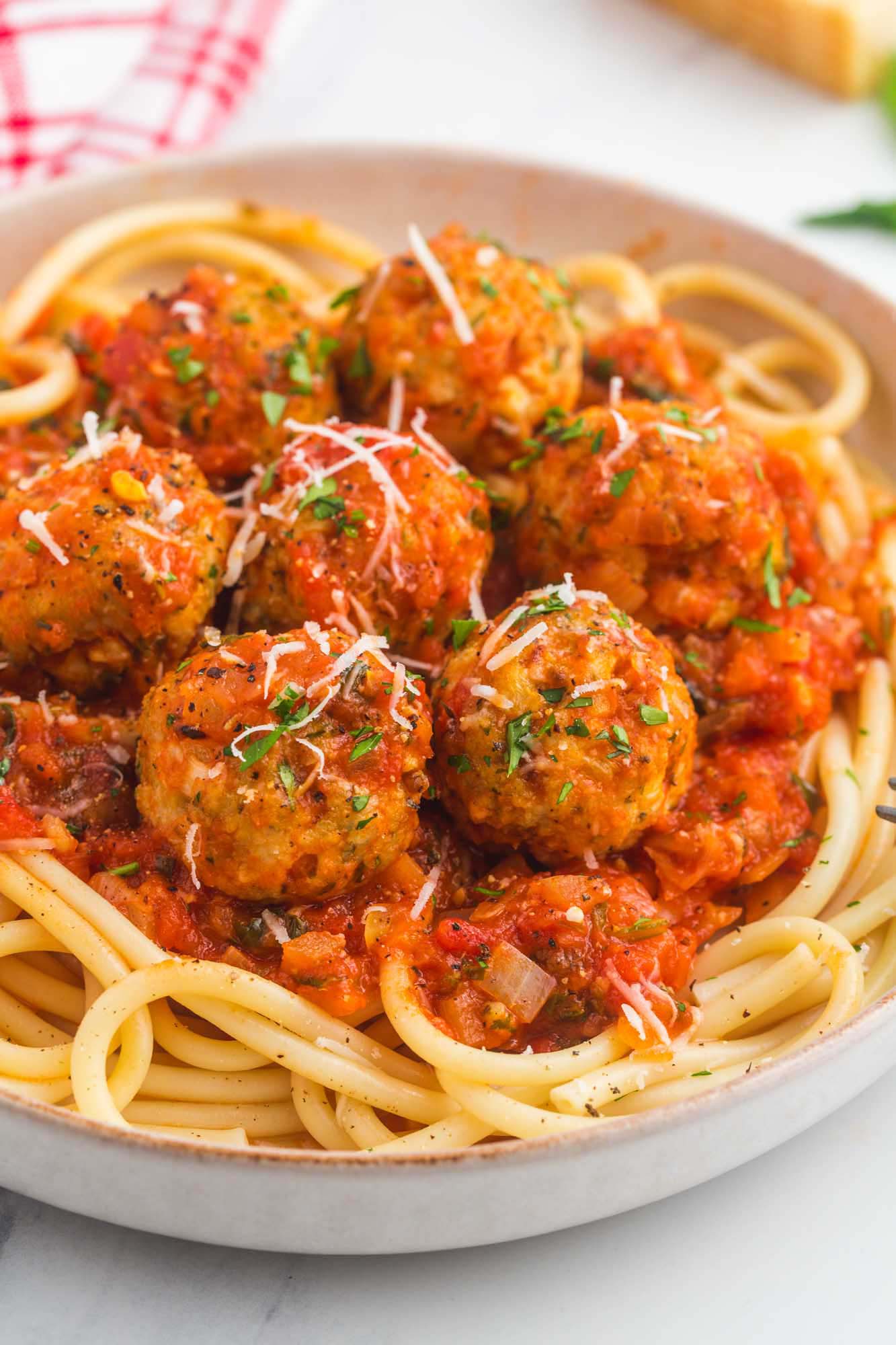 Turkey meatballs with tomato sauce served over spaghetti