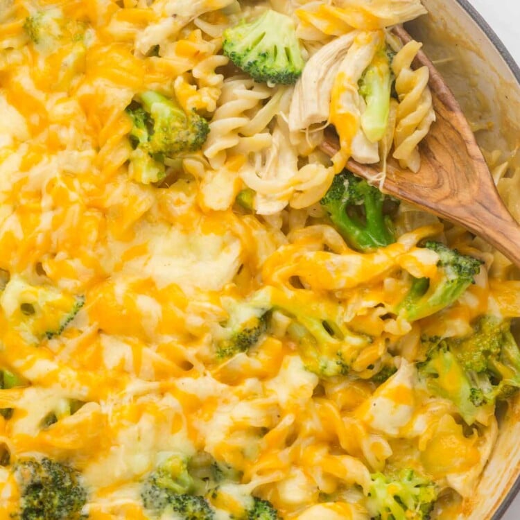 Overhead shot of broccoli chicken casserole and a wooden serving spoon