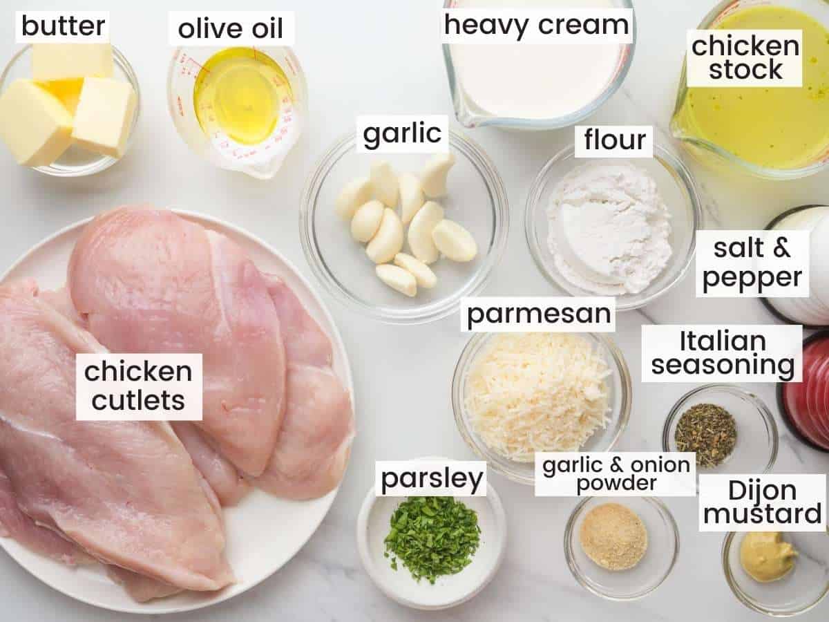 The ingredients for creamy garlic chicken, measured into separate bowls and laid out on the counter.